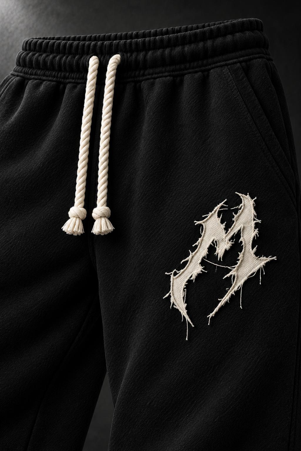 Wanted Tracksuit Black & Cream, patch close-up